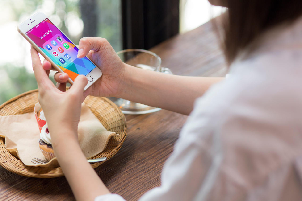 A woman uses her smartphone. (Getty Images Bank)