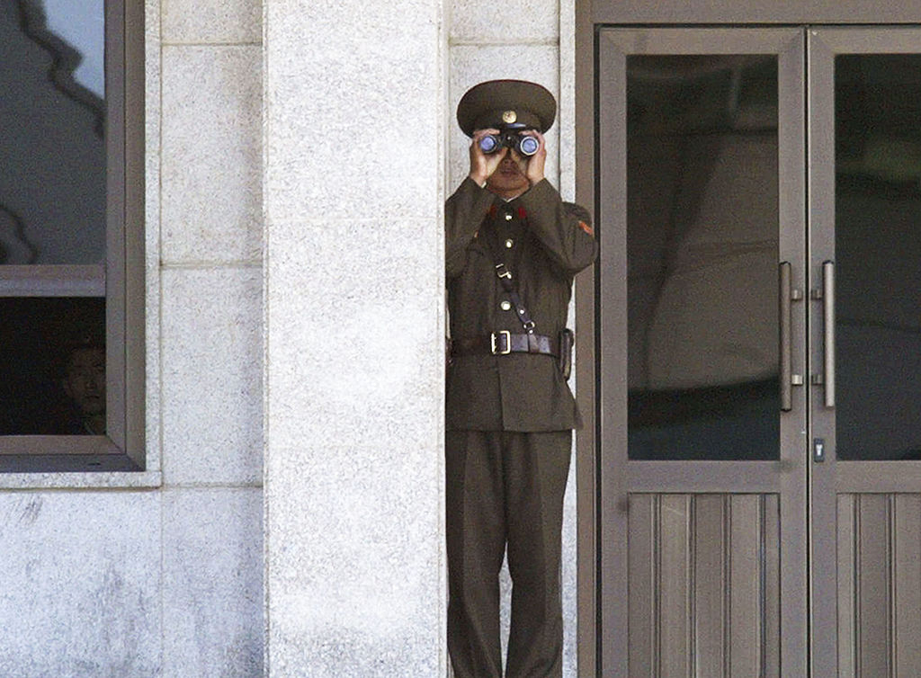 A North Korean soldier stands guard while looking toward South Korea at the border village of Panmunjom on Sept. 24, 2003. (Chung Sung-Jun/Getty Images)