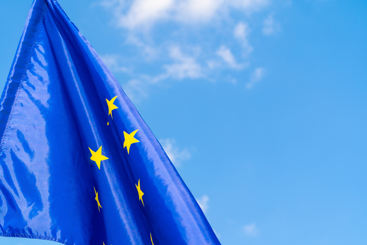 European Union flag against blue sky waving (123rf)