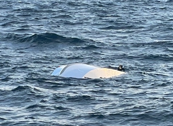 The capsized motorboat used by three men who were rescued early Monday after being found clinging to it near Choji Island off Ongjin County (Incheon Coast Guard)