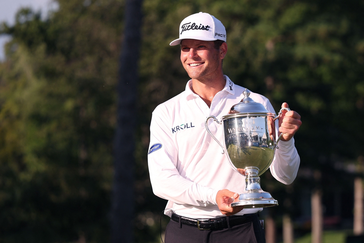Michael Brennan poses with the winner’s trophy after winning the Wyndham Championship at Sedgefield Country Club, in Greensboro, North Carolina, Sunday.    (AFP-Yonhap)