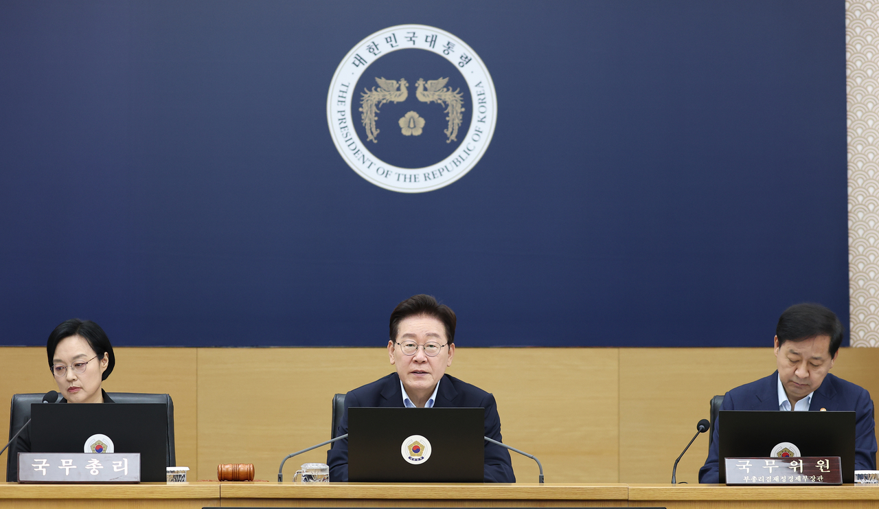 President Lee Jae Myung (C) speaks during a Cabinet meeting in the central city of Sejong on Tuesday. (Yonhap)