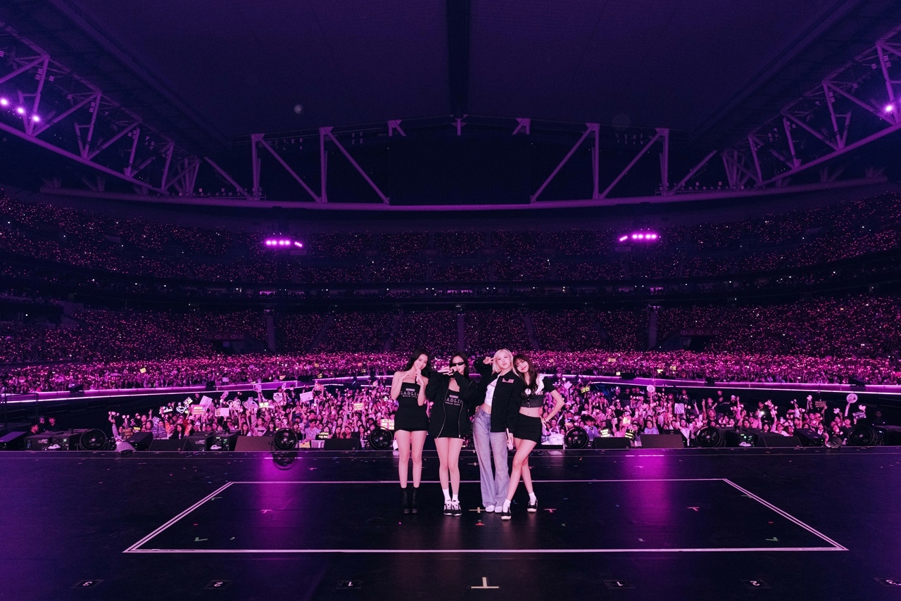 Blackpink poses for a photo on the stage during the "Deadline" world tour at Kai Tak Stadium in Hong Kong, Jan. 24. (YG Entertainment)