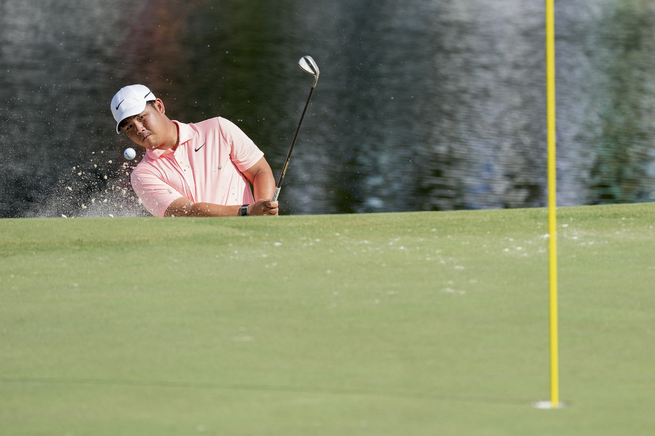 Tom Kim of South Korea plays a shot out of a bunker on the 15th hole during the final round of the Wyndham Championship at Sedgefield Country Club in Greensboro, North Carolina, on Sunday. (Imagn Images photo via Reuters)