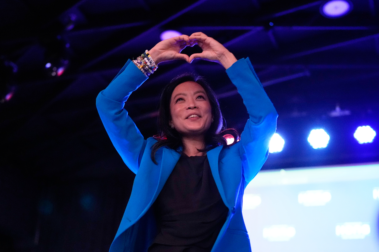 Democratic gubernatorial candidate Francesca Hong makes a heart gesture to supporters after speaking during a primary election night watch party Tuesday in Madison, Wis. (AP)