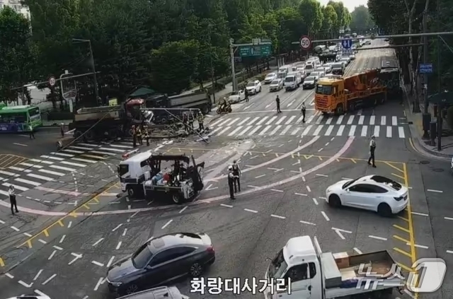 Two drivers were injured after three dump trucks collided in succession at Hwarangdae Intersection in Nowon-gu, Seoul, at around 7:01 a.m. on June 29. [Road Traffic Information Center]
