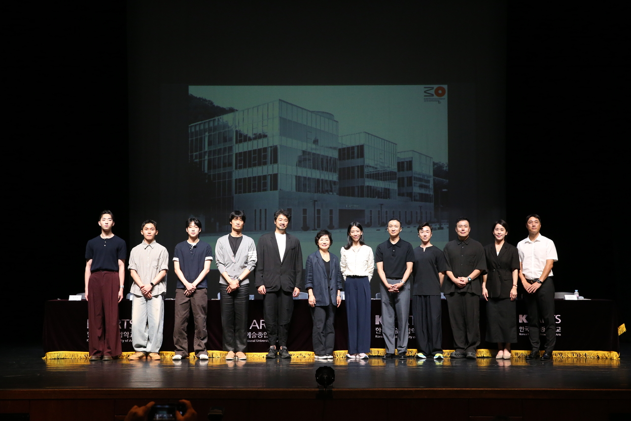 Alumni and faculty members pose for a photo after a press conference marking the 30th anniversary of the School of Dance at the Korea National University of Arts in Seoul on Tuesday. (Yonhap)