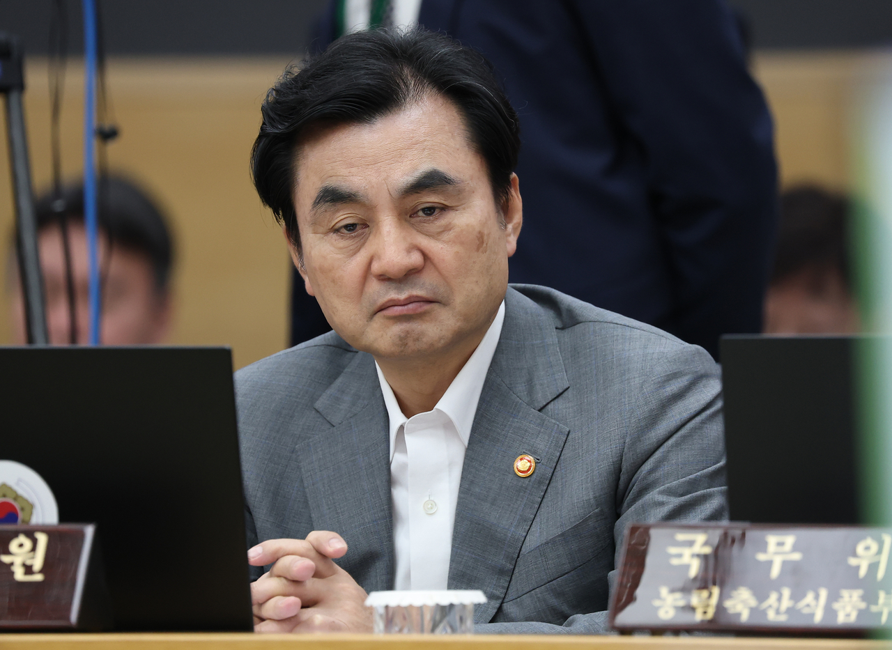 Defense Minister Ahn Gyu-back watches a video during a Cabinet meeting chaired by President Lee Jae Myung at the Government Complex Sejong on Tuesday. (Yonhap)