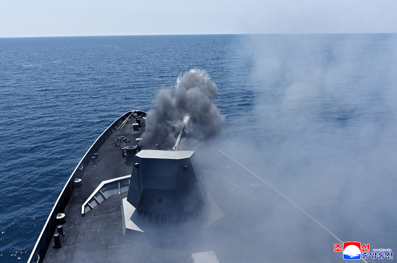 A naval gun aboard North Korea’s new 5,000-ton-class destroyer Kang Kon is test-fired during a demonstration observed by North Korean leader Kim Jong-un on July 3. (KCNA via Yonhap)
