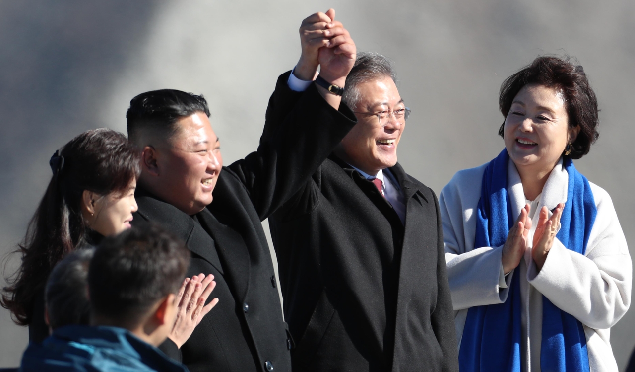 President Moon Jae-in (second from right) poses with North Korean leader Kim Jong Un (second from left), Moon’s wife Kim Jung-sook (right) and Kim’s wife Ri Sol Ju atop Mount Paektu in North Korea on Sept. 20, 2018, during Moon’s visit to Pyongyang for an inter-Korean summit. (Pyongyang Press Corps via Getty Images)