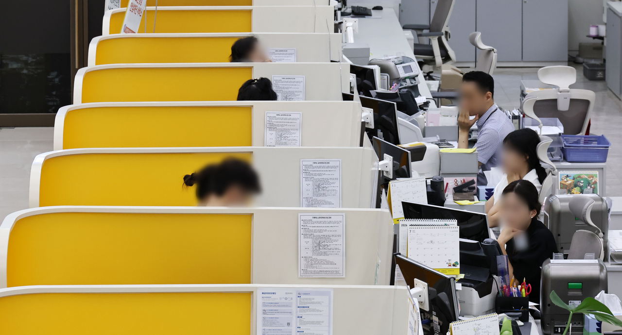 This file photo taken July 9, shows booths at a branch of KB Kookmin Bank in Seoul. (Yonhap)