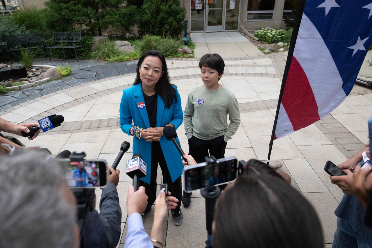 With her son George by her side, Democratic Wisconsin gubernatorial candidate Francesca Hong speaks to reporters after voting in the primary election on Aug. 11, 2026 in Madison, Wisconsin. (AFP-Yonhap)