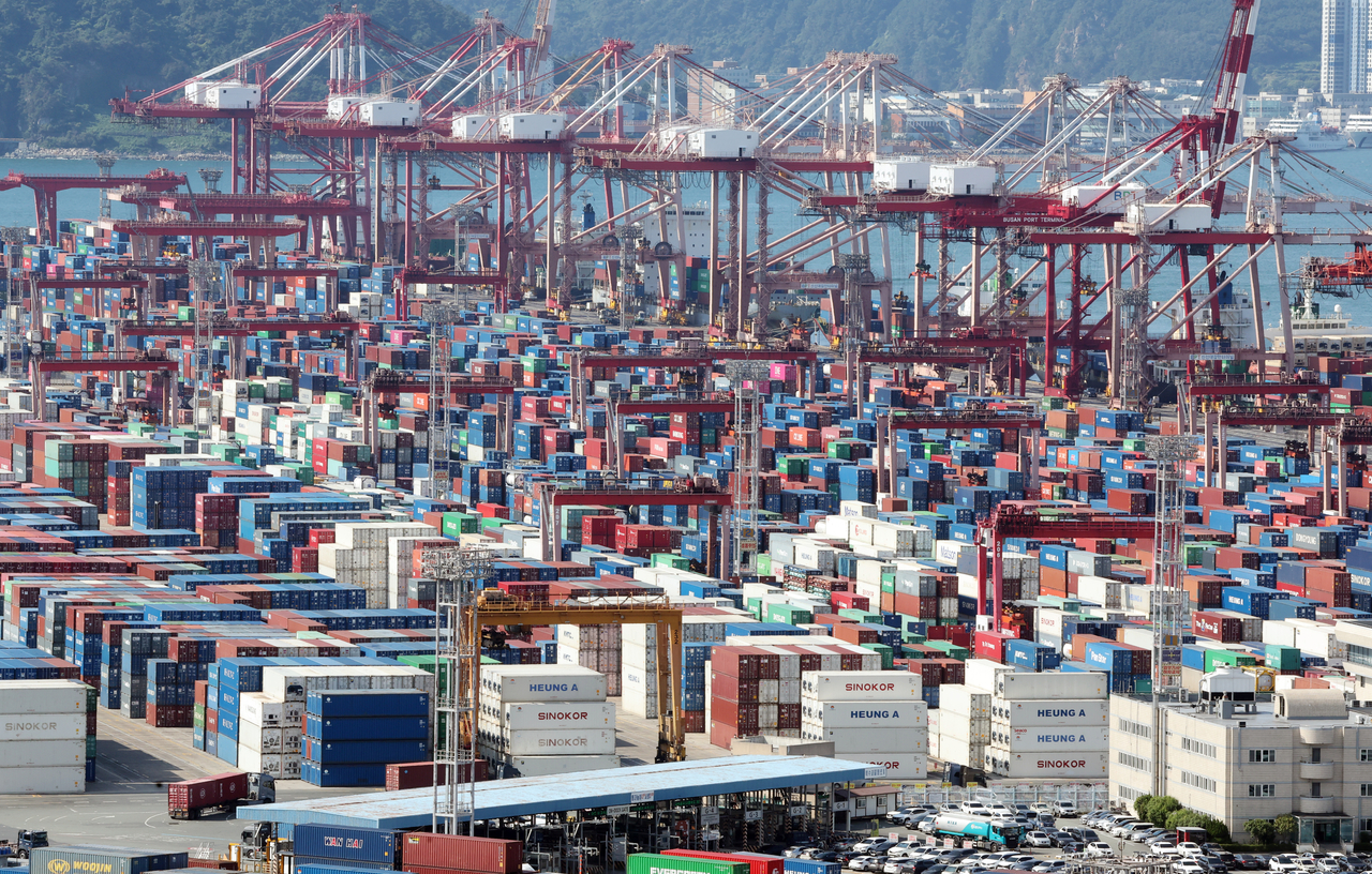 Containers are stacked at a port in Busan on Aug. 6. (Yonhap)
