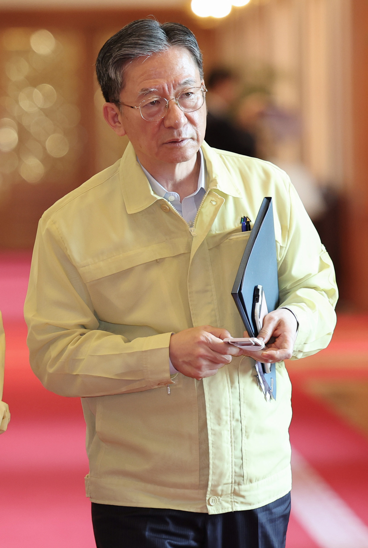 Justice Minister Jung Sung-ho heads to a Cabinet meeting on Tuesday presided over by President Lee Jae Myung at the presidential office in Seoul. (Presidential Press Corps via Yonhap)