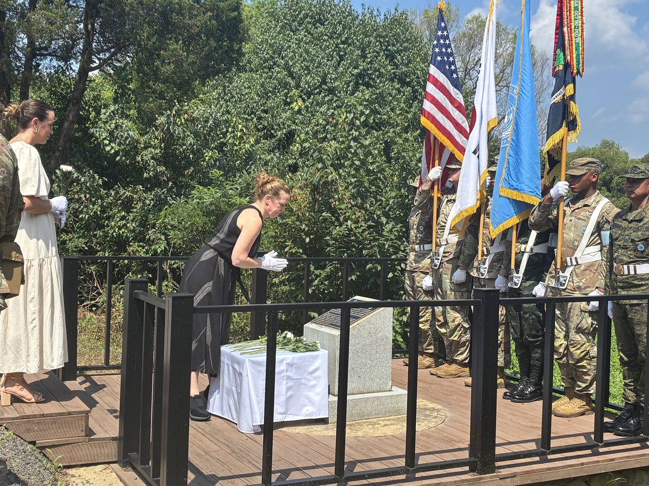 Megan DeCore lays a wreath at a memorial site inside the Joint Security Area in Gyeonggi Province on Tuesday. (Joint Press Corps)