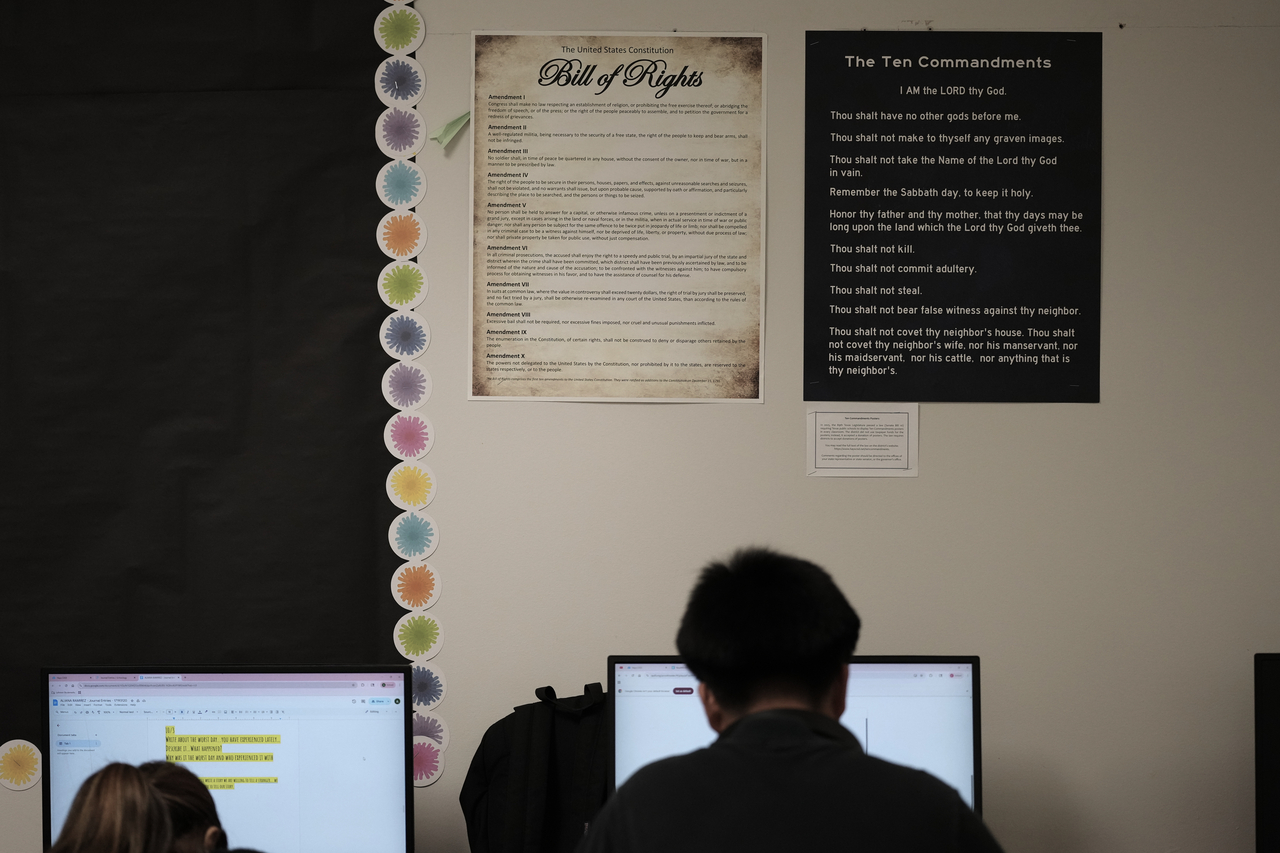 Students work under Ten Commandments and Bill of Rights posters on display in a classroom at Lehman High School in Kyle, Texas, Oct. 16, 2025. (AP-Yonhap)
