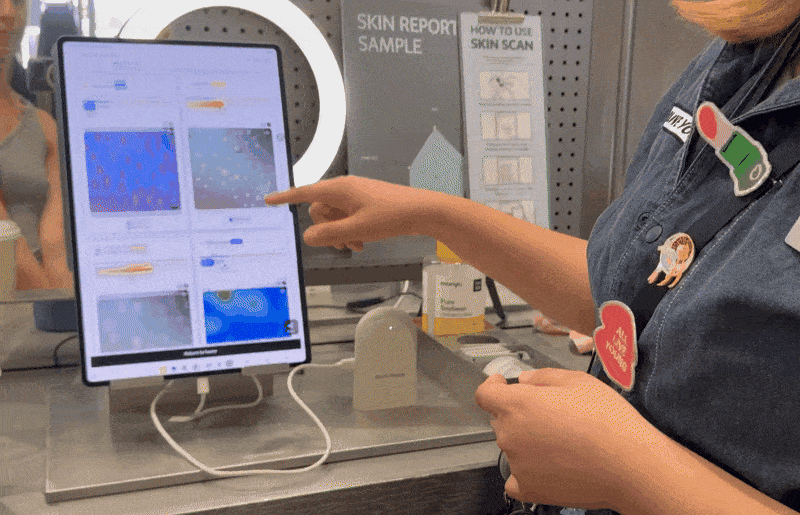 A consultant walks a customer through her Skin Scan results at Olive Young's US store in Pasadena, California, Friday. (No Kyung-min/The Korea Herald)