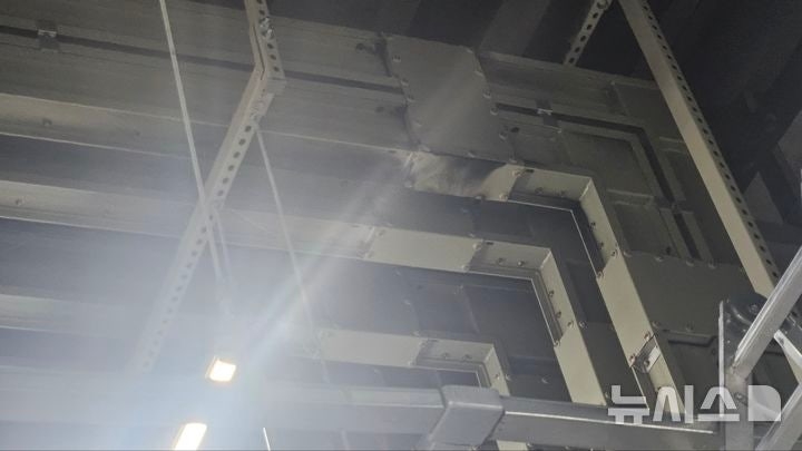 Smoke rises from an electrical distribution panel in a mechanical room on the first basement level of a logistics warehouse in Wonchang-dong, Seohae District, Incheon, on Wednesday. (Incheon Fire Department-Newsis)
