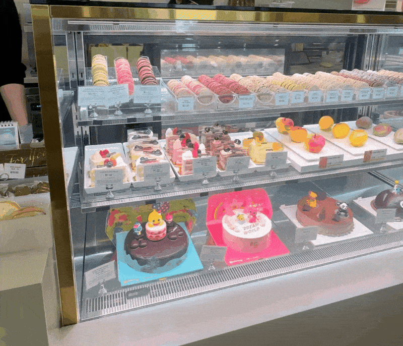 Cakes, including the whipped-cream Cloud Cake and fruit-shaped Agjak, line a display case at a Tous Les Jours store in La Habra, California, on Friday. (No Kyung-min/The Korea Herald)