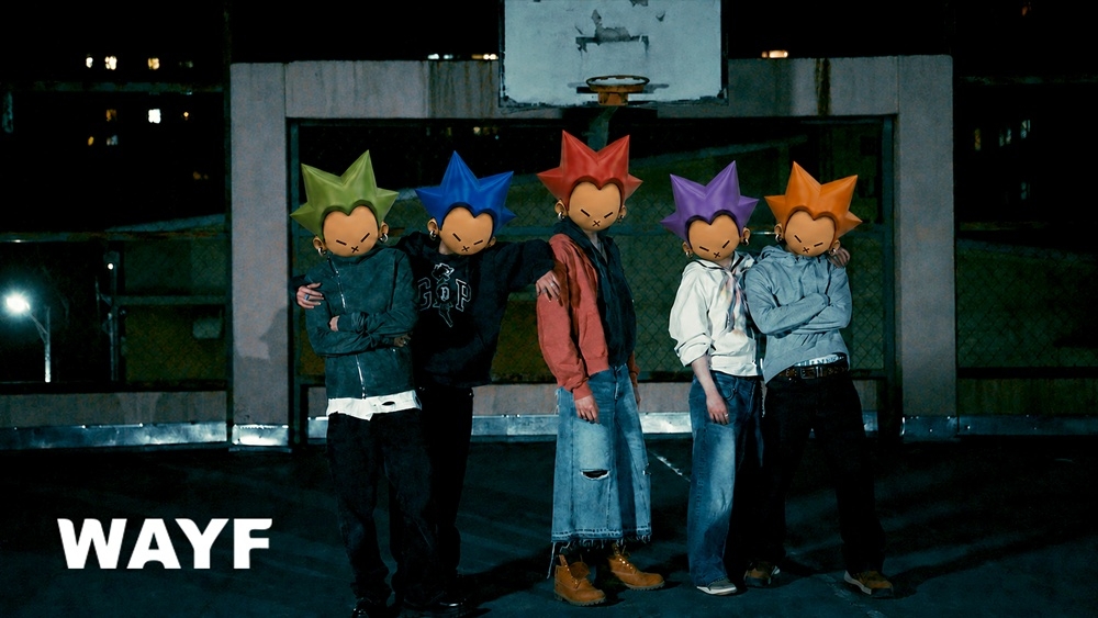 Wayf Boys behind illustrated character drawn by member Anderson (Wayf)