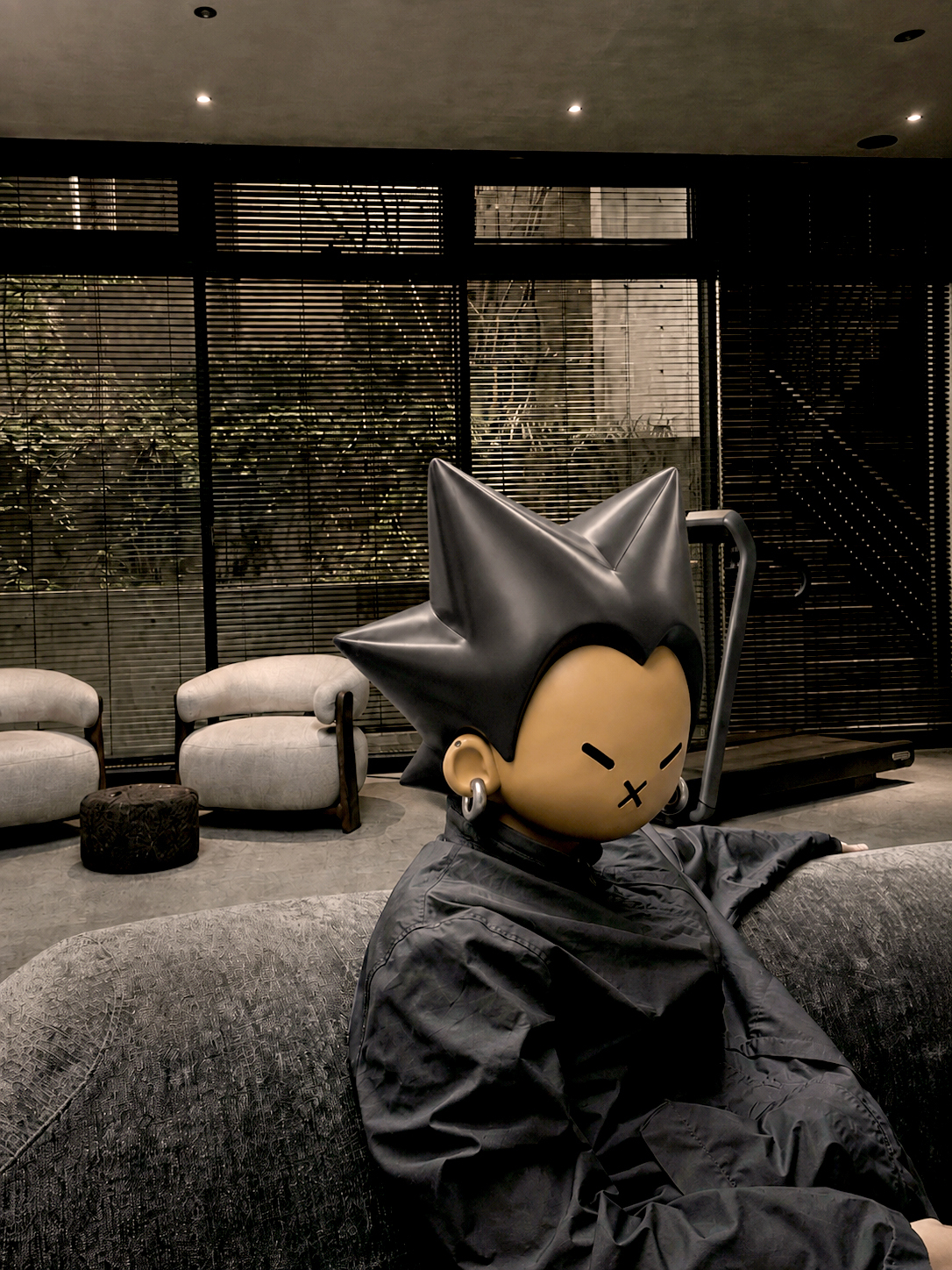 Son Sung-ho, also known as Czaer, poses behind an illustrated character drawn by Wayf Boys member Anderson at Wayf’s office in Seoul, Wednesday. (Wayf)