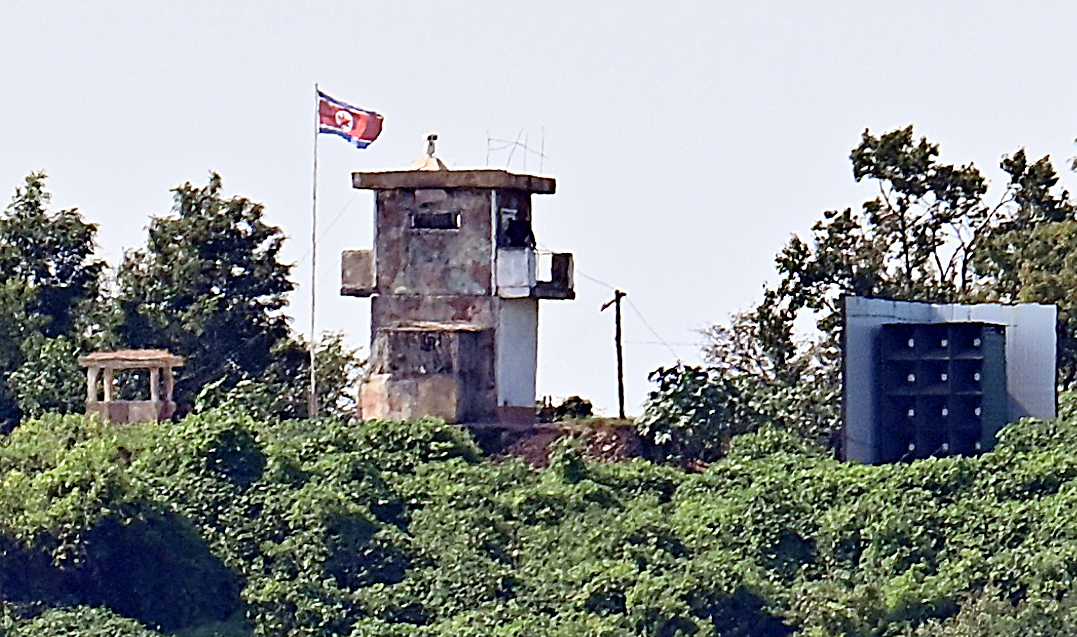 A North Korean flag flies at a North Korean military guard post, as seen from the border city of Paju, Gyeonggi Province, Tuesday, the second day of the South Korea-US Ulchi Freedom Shield military exercise. (Yonhap)