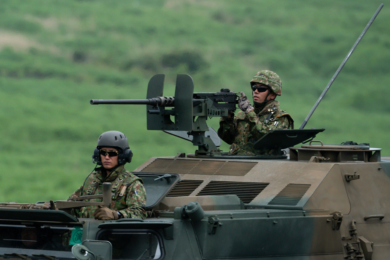 Members of the Japan Ground Self-Defense Force take part in a live-fire exercise at the East Fuji Maneuver Area in Gotemba, Shizuoka Prefecture on June 7. (Getty Images)