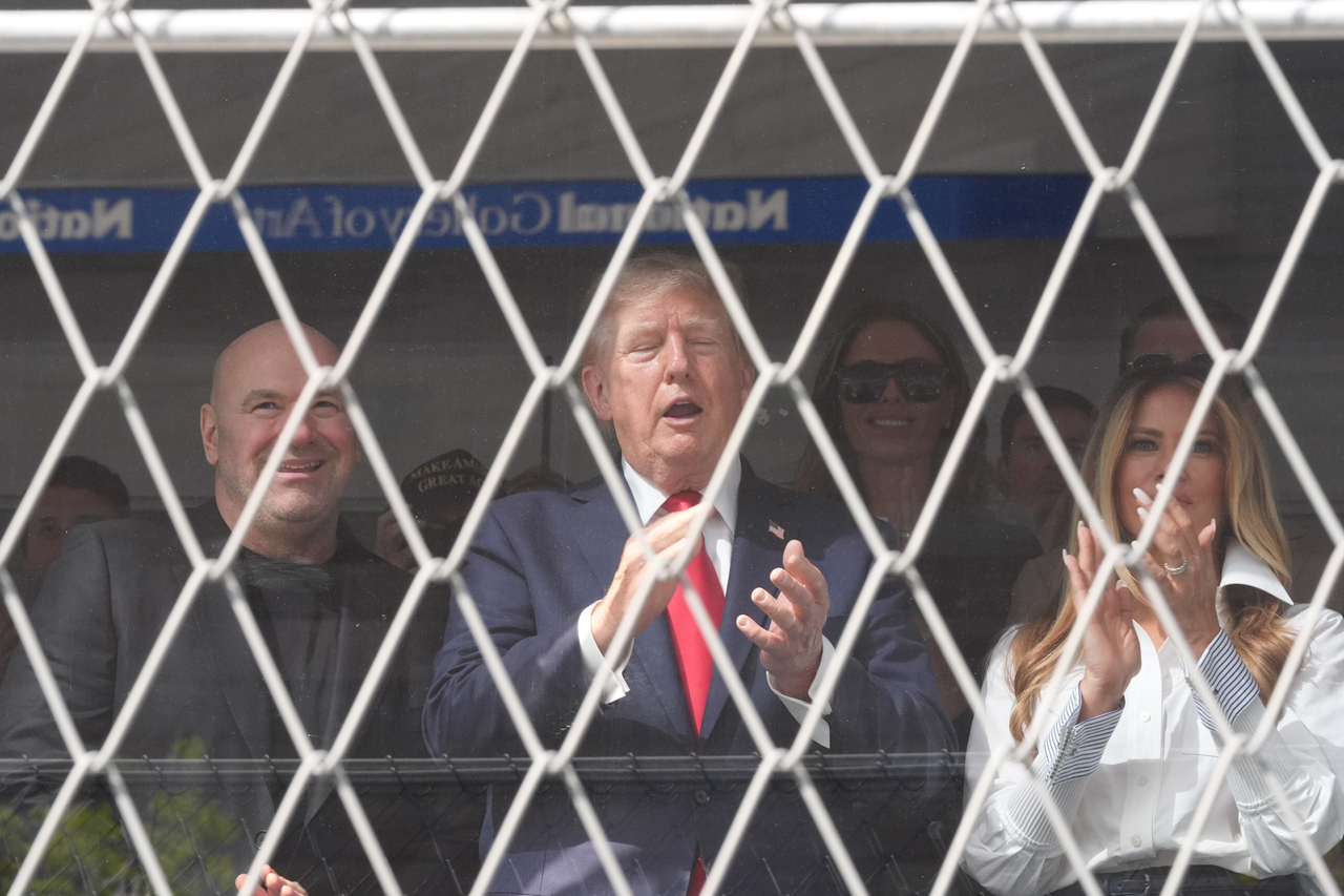 President Donald Trump (second from left), UFC president and CEO Dana White, and first lady Melania Trump (far right) applaud after Kyle Kirkwood, 27, won the Freedom 250 Grand Prix IndyCar race in Washington on Sunday local time. [AP]