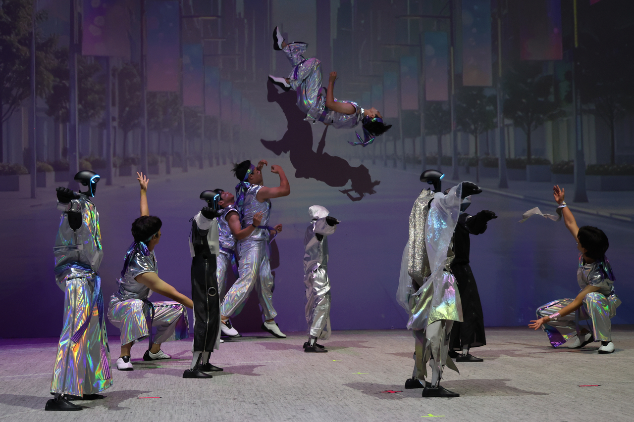 Galaxy Corporation's humanoid robots perform with humans during the grand opening of Galaxy Robot Park in Gangdong-gu, Seoul, Friday. (Yonhap)