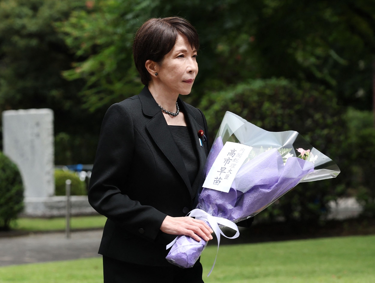 Japan's Prime Minister Sanae Takaichi offers flowers at the Chidorigafuchi National Cemetery in Tokyo on Aug. 15 on the 81st anniversary of Japan's surrender in World War II. (AFP-Yonhap)
