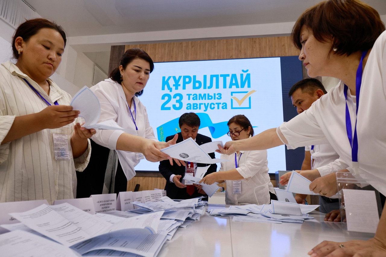 Members of a local electoral commission count ballots at a polling station during parliamentary elections, in Almaty, Kazakhstan, Sunday. (AFP-Yonhap)