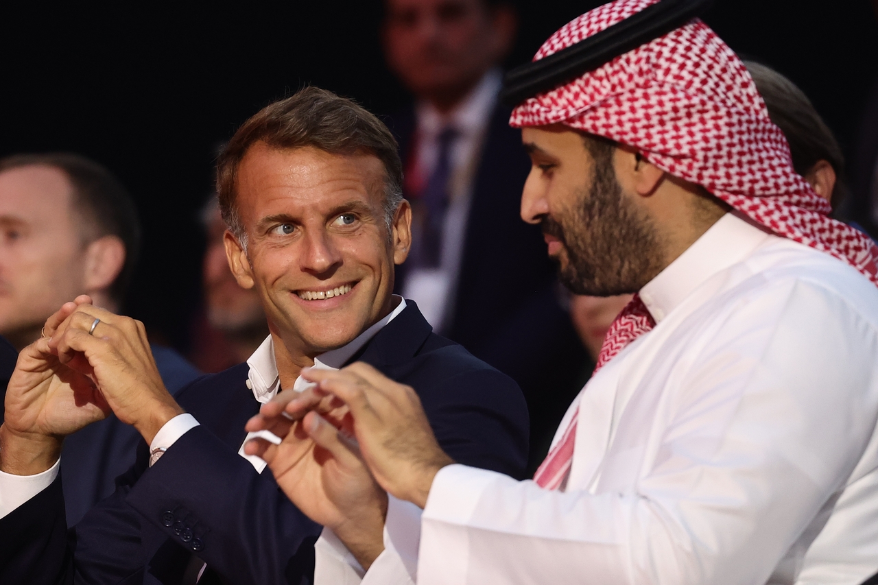 France's President Emmanuel Macron (left) and Saudi Crown Prince Mohammed bin Salman attend the closing ceremony of the Esports World Cup at the Grand Palais in Paris, Sunday. (AP-Yonhap)