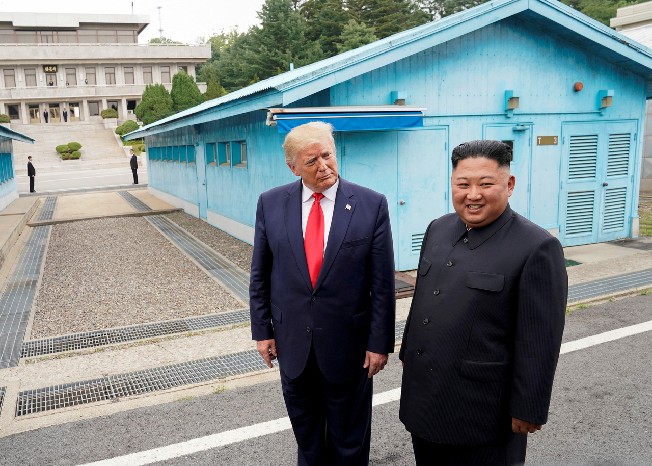 US President Donald Trump (left) meets with North Korean leader Kim Jong-un at the demilitarized zone separating the two Koreas, in Panmunjom, South Korea, June 30, 2019. (Reuters via Yonhap)