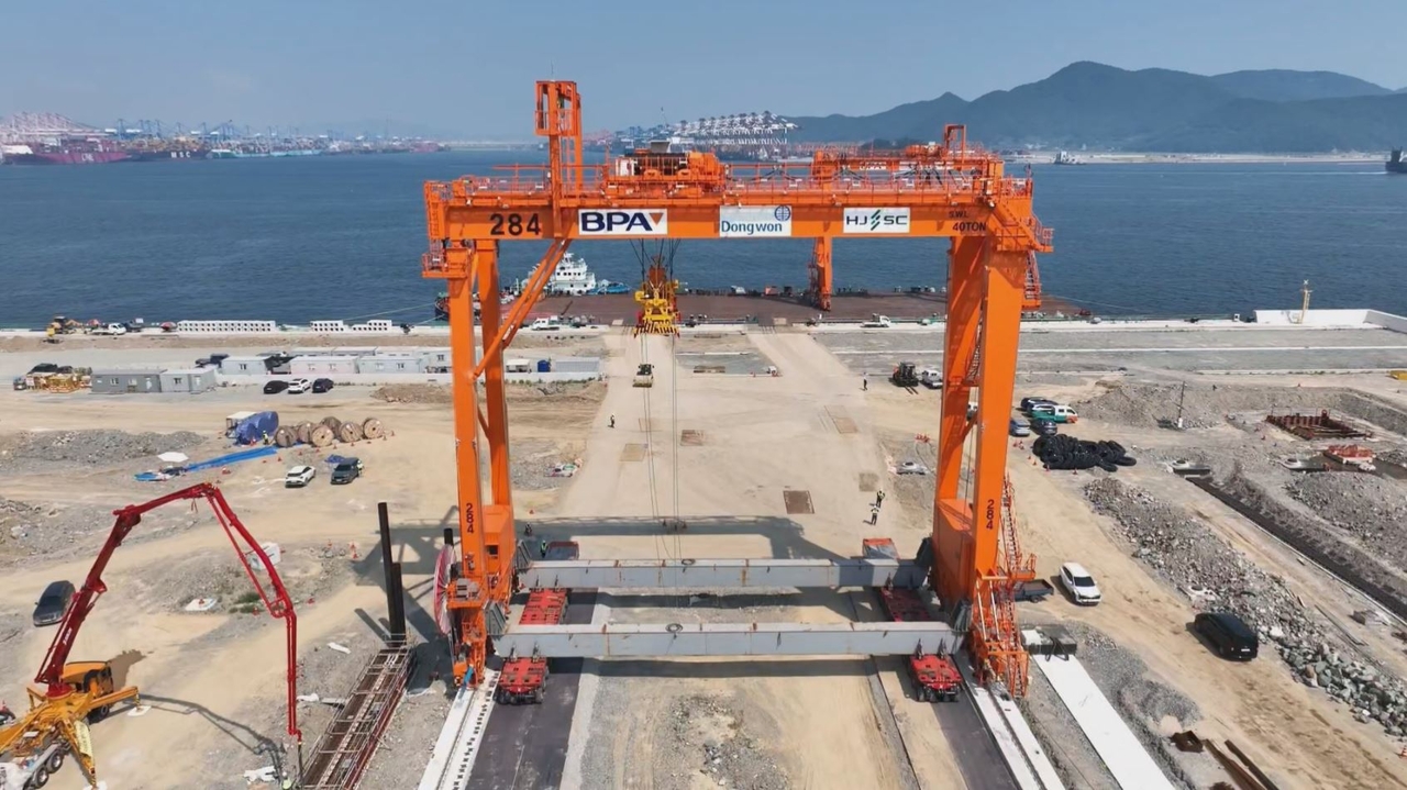 The Busan Port Authority has begun the phased transport of 34 domestically manufactured automated transfer cranes to the Busan New Port West Container Terminal Phase 2-6, South Korea's first automated container terminal. [Busan Port Authority]
