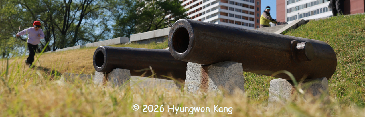 A boy plays near replicas of cannons recovered from the wreck of the General Sherman, which was sunk in 1866, along the Taedonggang River in Pyongyang. (Hyungwon Kang)