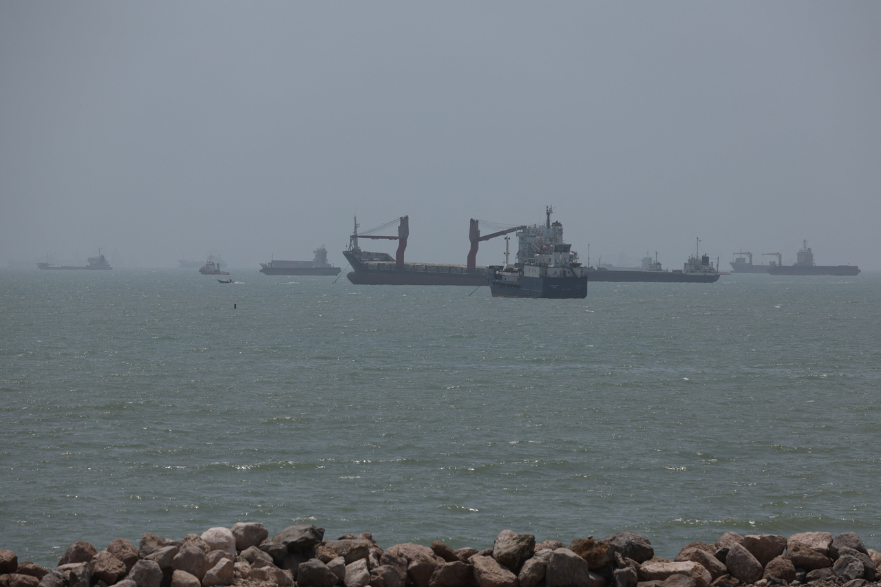 Vessels in the Strait of Hormuz are visible near the beach of Bandar Abbas, Iran, on Wednesday. (Reuters/ Yonhap)