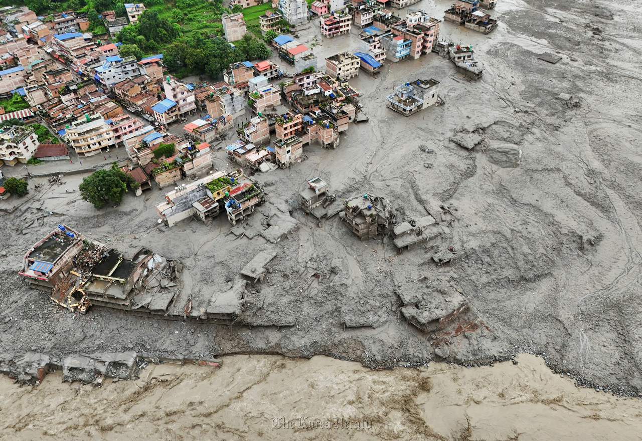 A drone view shows mud covering properties following a flash flood in Trishuli, Nuwakot district, Nepal, Thursday.   Reuters-Yonhap
