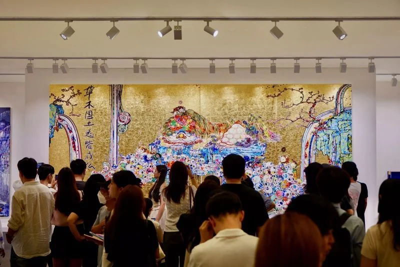 Visitors view a work by Takashi Murakami in Gagosian's booth during Frieze Seoul 2025 at Coex, southern Seoul (Frieze)