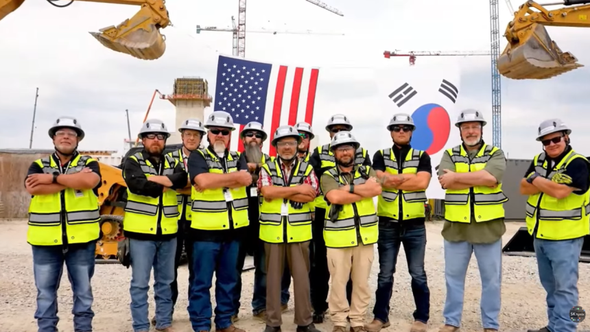 Workers pose at the construction site of SK hynix’s advanced packaging facility in Indiana. (Screenshot from SK hynix’s YouTube channel)