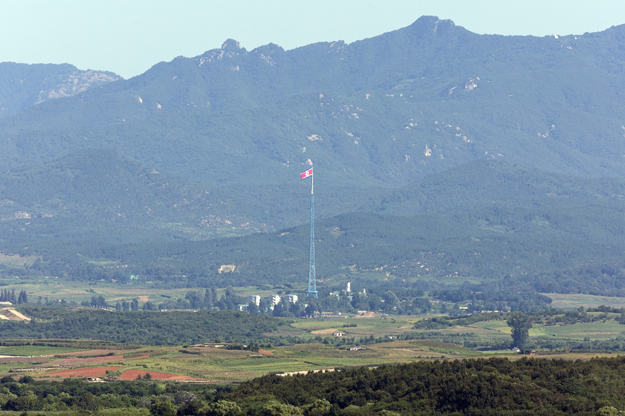 North Korean flag is visible on the north side of the Demilitarized Zone near Paju, Gyeonggi Province in a photograph taken on Aug. 12. (Yonhap)