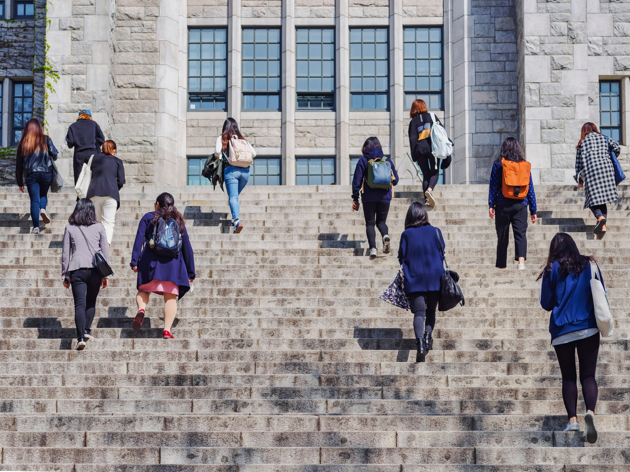 Students climb stairs at a university campus in Seoul. (123rf)