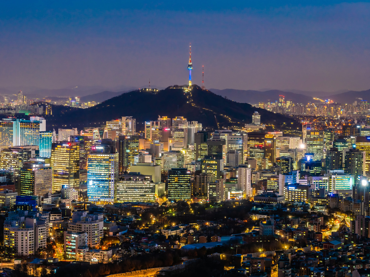 A nighttime view of central Seoul, with Namsan Seoul Tower in the background. (123rf)