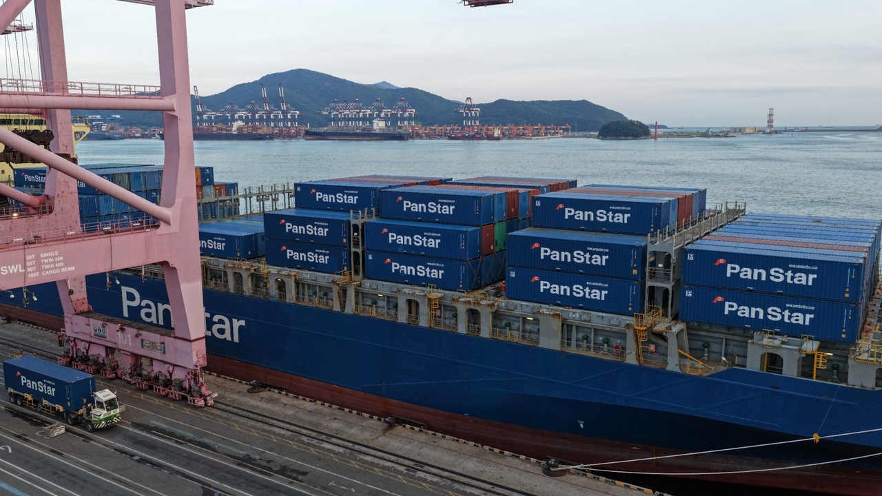 The PanStar Acro loads cargo at Busan New Port on Aug. 22 before departing on a trial voyage through the Northern Sea Route. (Yonhap)