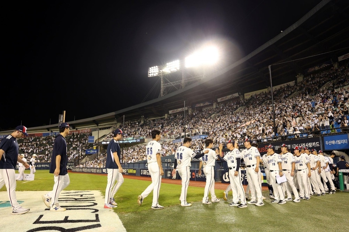 Doosan Bears players celebrate their 15-1 win over the Kiwoom Heroes in their Korea Baseball Organization regular-season game at Jamsil Baseball Stadium in Seoul on Sunday. (Doosan Bears)