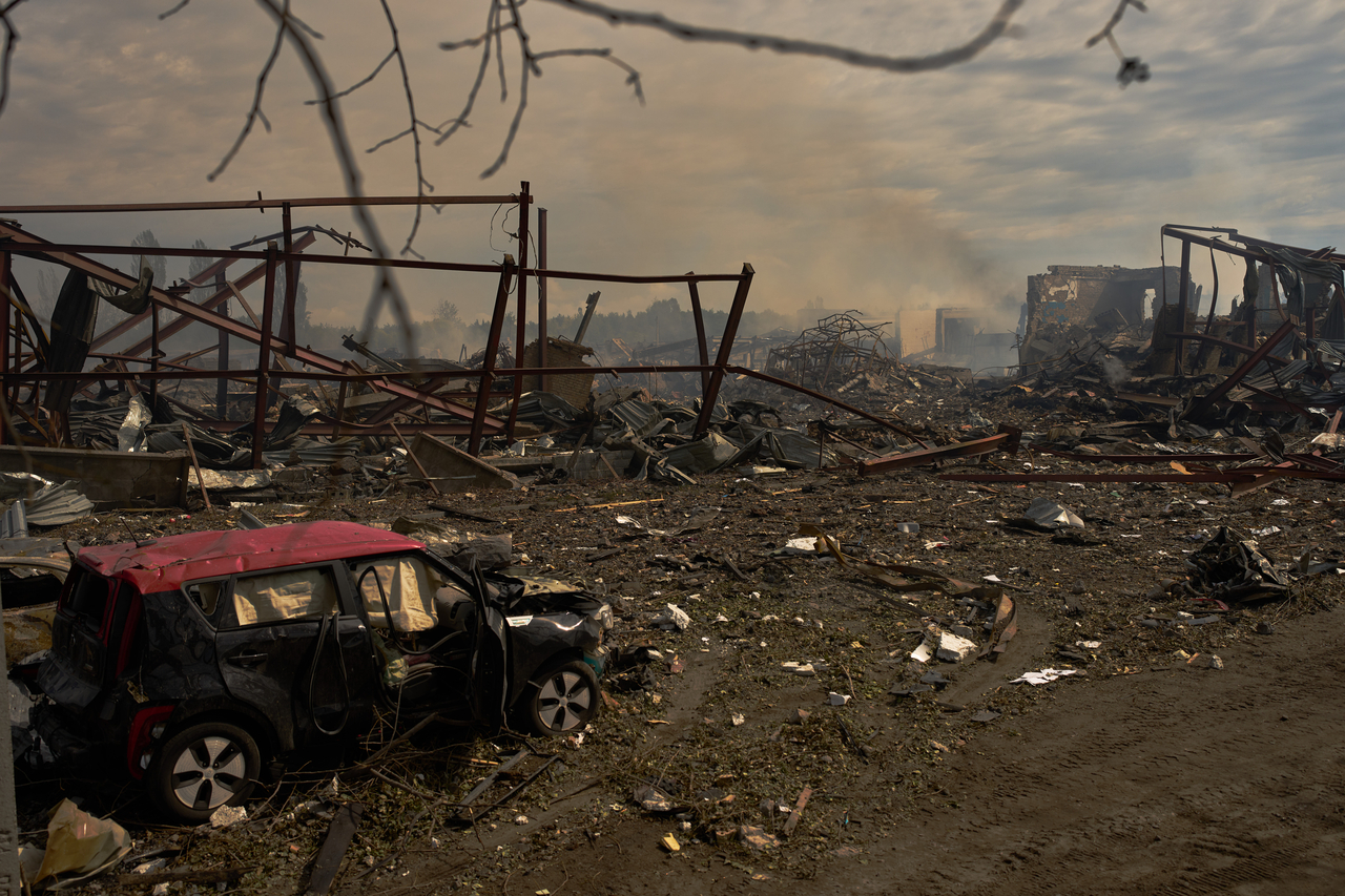Destroyed vehicles and debris are scattered the day after a Russian attack struck a warehouse, followed by an explosion, in the village of Myla, outskirts of Kyiv, Ukraine, Sunday. (AP-Yonhap)