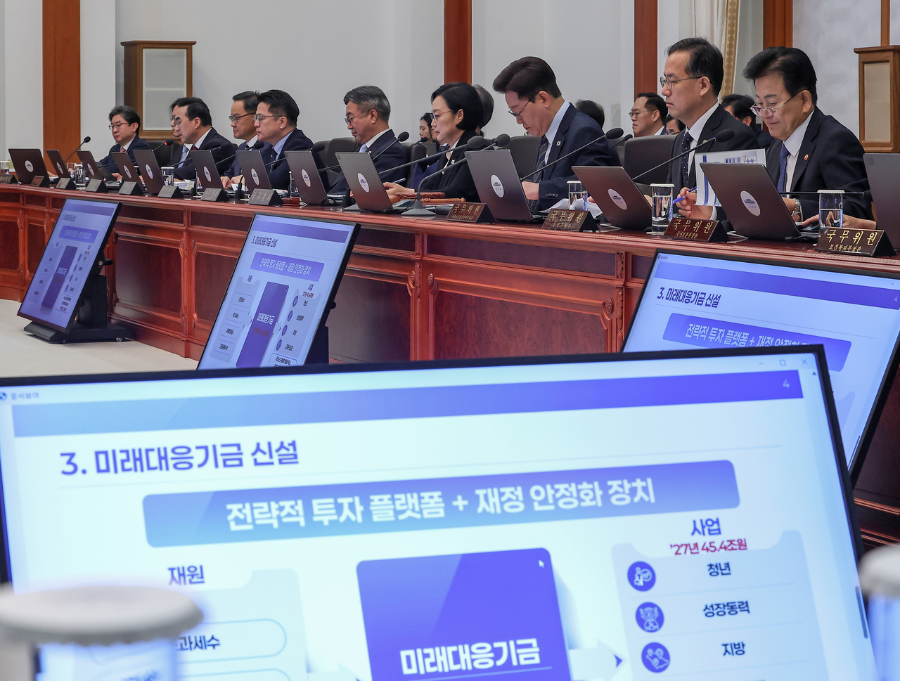 President Lee Jae Myung receives a briefing from the Ministry of Planning and Budget on the 2027 budget proposal and the 2026-2030 national fiscal management plan during a Cabinet meeting at Cheong Wa Dae in Seoul on Tuesday. (Yonhap)