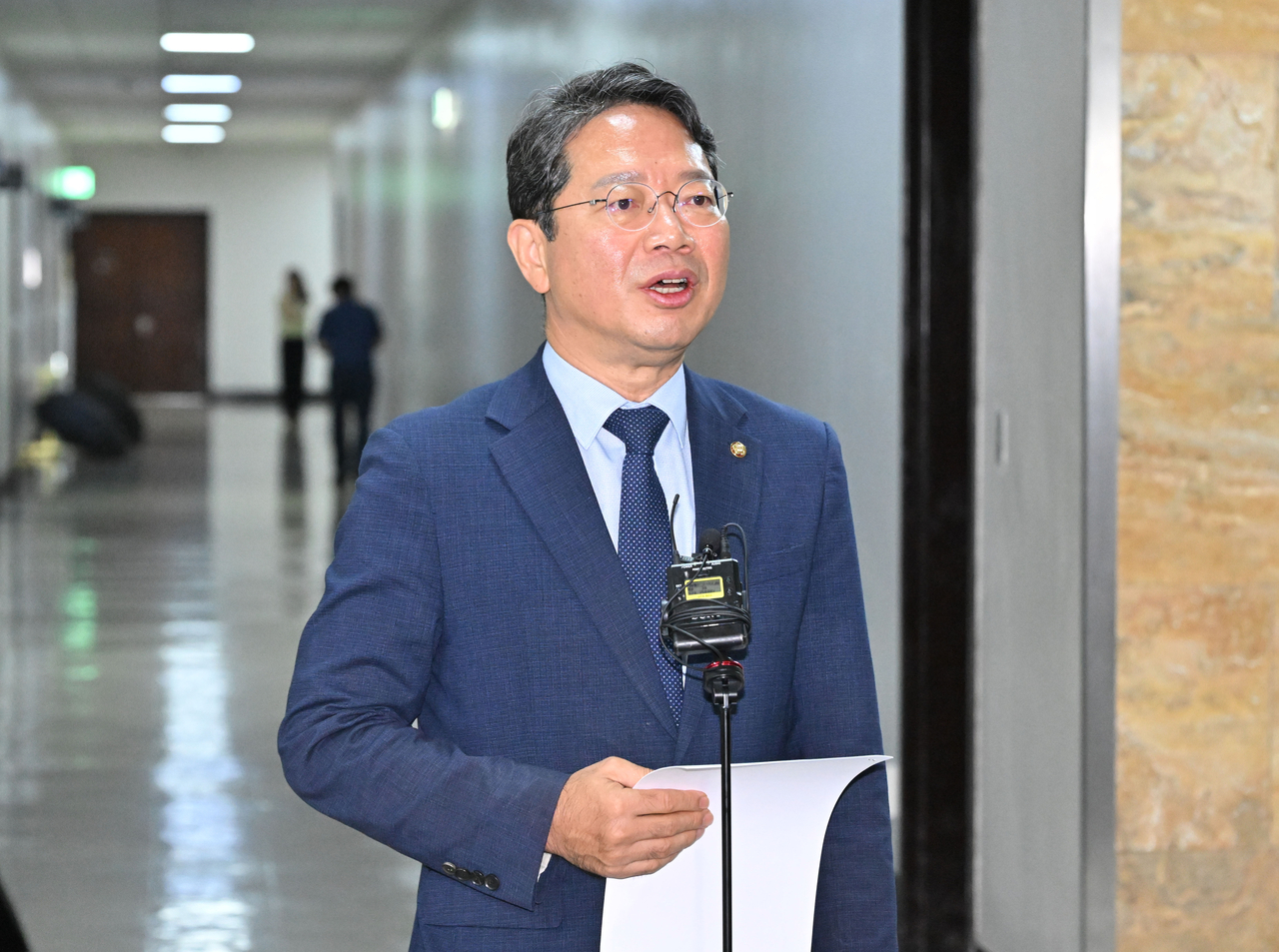 Kim Seung-won, nominee for minister of justice, speaks to reporters after attending a subcommittee meeting of the National Assembly's Legislation and Judiciary Committee on Monday.