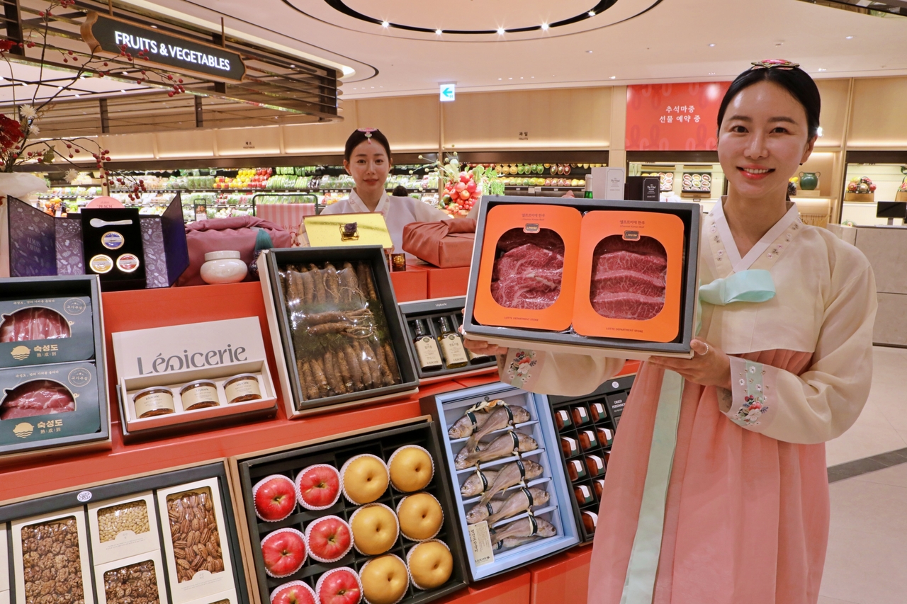 Models promote 2026 Chuseok gift sets at the basement level of Lotte Department Store's Nowon-gu branch in Seoul. [Lotte Department Store]