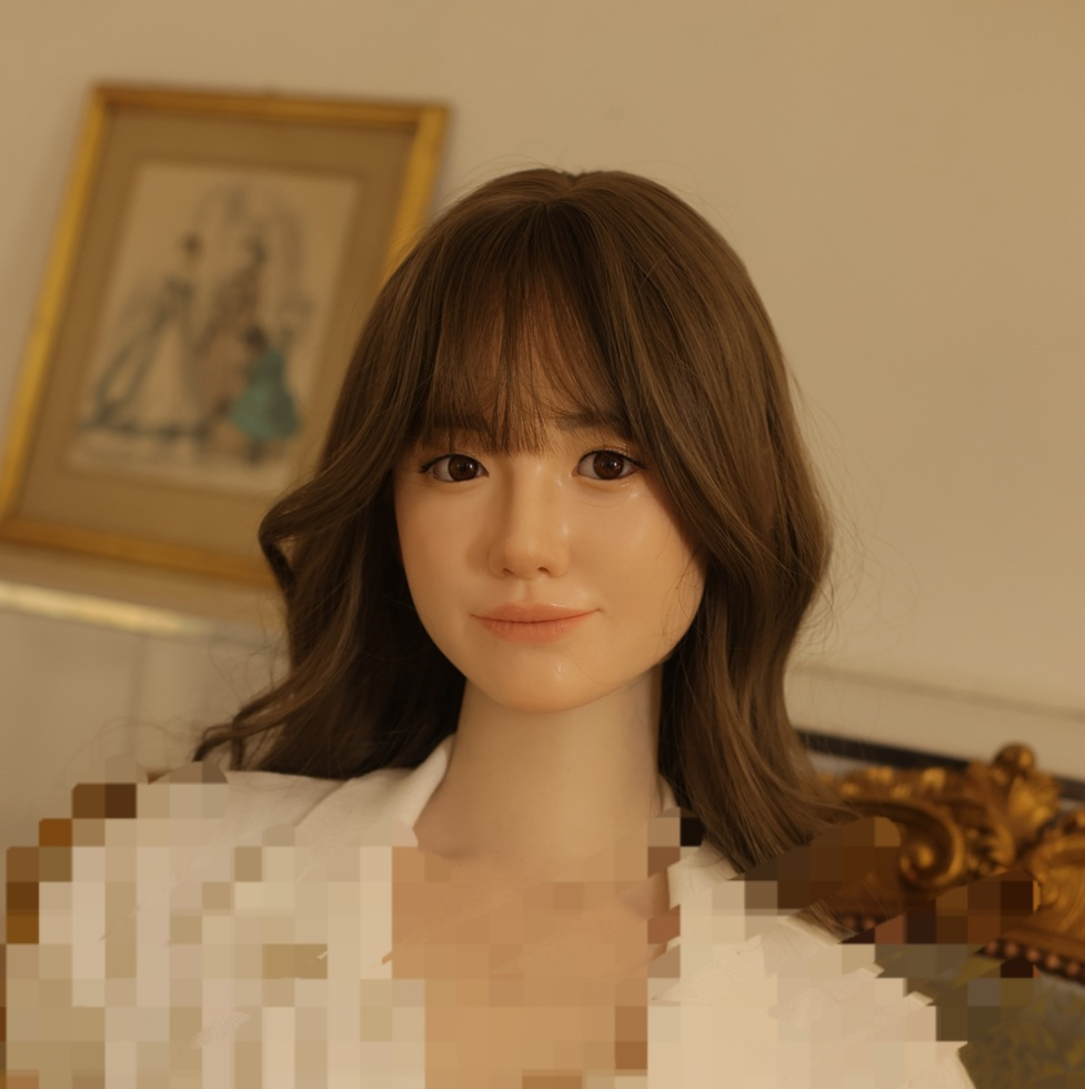 A life-size sex doll is displayed on a sofa at a showroom in Eunpyeong-gu, Seoul. (Showroom operator Lee)