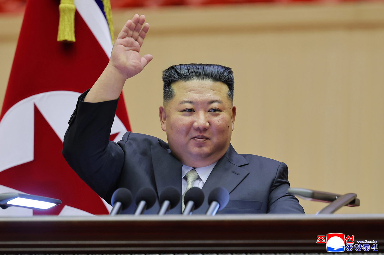 North Korean leader Kim Jong-un waves during the 15th National Conference of Teachers opens in Pyongyang on Wednesday, in this photo released by North Korea's official Korean Central News Agency the following day. (KCNA-Yonhap)